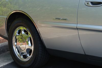 Factory chrome wheel on a 1999 Silver Arrow
