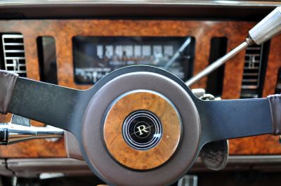 Wood veneer horn cap on leather wrapped  sport steering wheel
